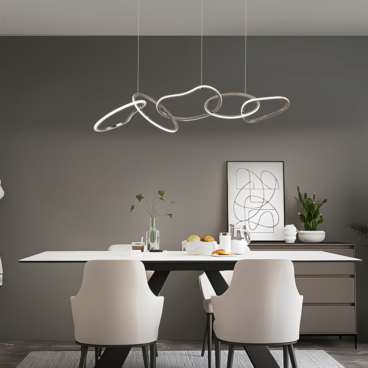 Lustre LED de luxe nordique en acier inoxydable à motifs entrelacés, idéal pour une salle à manger ou un plafond.