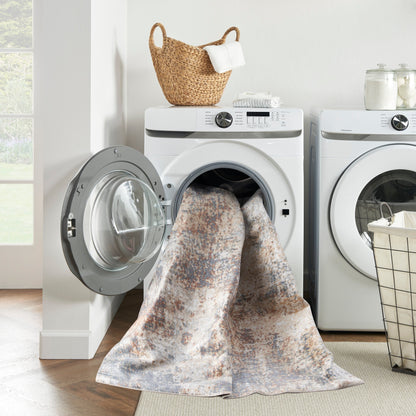 Tapis Nourison Astra lavable en machine à motifs abstraits