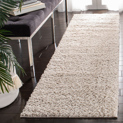 Tapis SAFAVIEH August Wilhelma Shag uni de 3 cm d'épaisseur