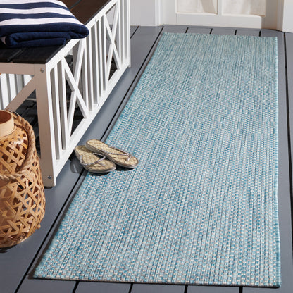 Tapis de patio/jardin imperméable SAFAVIEH Courtyard Begajeta pour intérieur/extérieur.