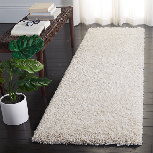 Tapis SAFAVIEH Evolution Shag Fransien uni de 4,6 cm d'épaisseur