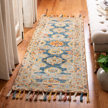Tapis en laine à pompons bohème SAFAVIEH fait main en tremble Kimm