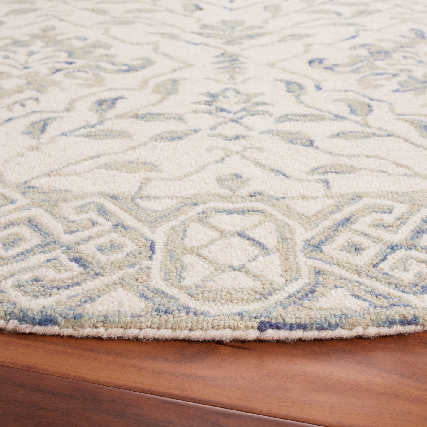 Tapis en laine Elvedina à motif floral, teint à la main par SAFAVIEH