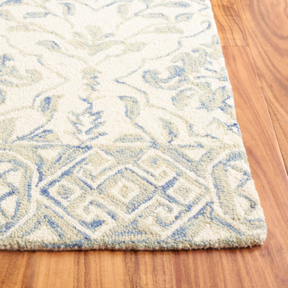 Tapis en laine Elvedina à motif floral, teint à la main par SAFAVIEH
