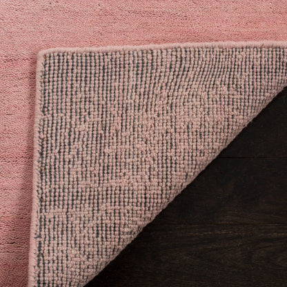 Tapis moderne en laine SAFAVIEH fait main, bordure en palmier de l'Himalaya