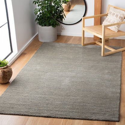 Tapis moderne en laine SAFAVIEH fait main, bordure en palmier de l'Himalaya