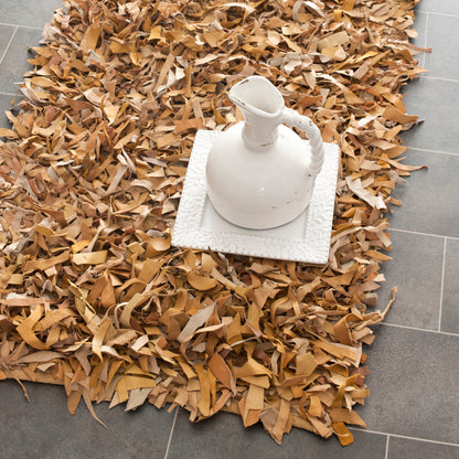 Tapis décoratif moderne SAFAVIEH en cuir shaggy fait main Doinita