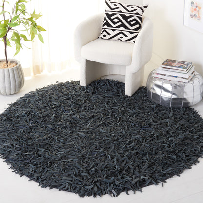Tapis décoratif moderne SAFAVIEH en cuir shaggy fait main Doinita