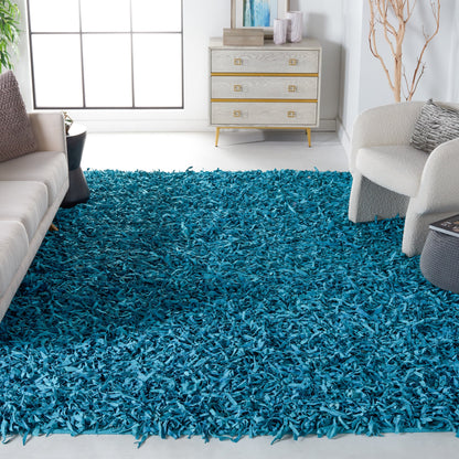 Tapis décoratif moderne SAFAVIEH en cuir shaggy fait main Doinita