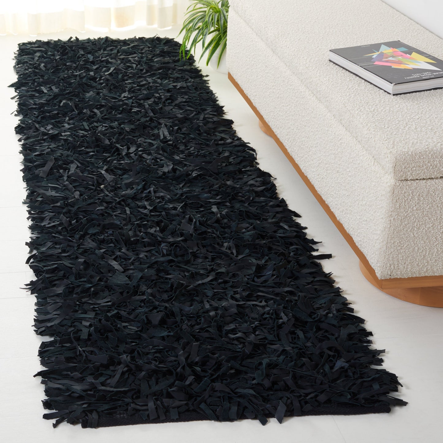 Tapis décoratif moderne SAFAVIEH en cuir shaggy fait main Doinita