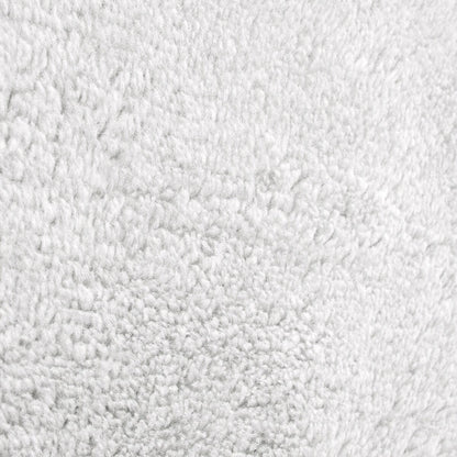 Tapis doux et lavable avec envers antidérapant, disponible en couleurs unies.