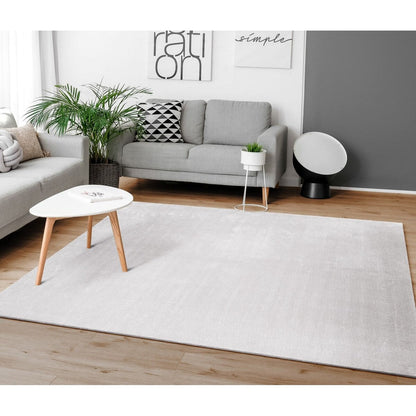 Tapis doux et lavable avec envers antidérapant, disponible en couleurs unies.